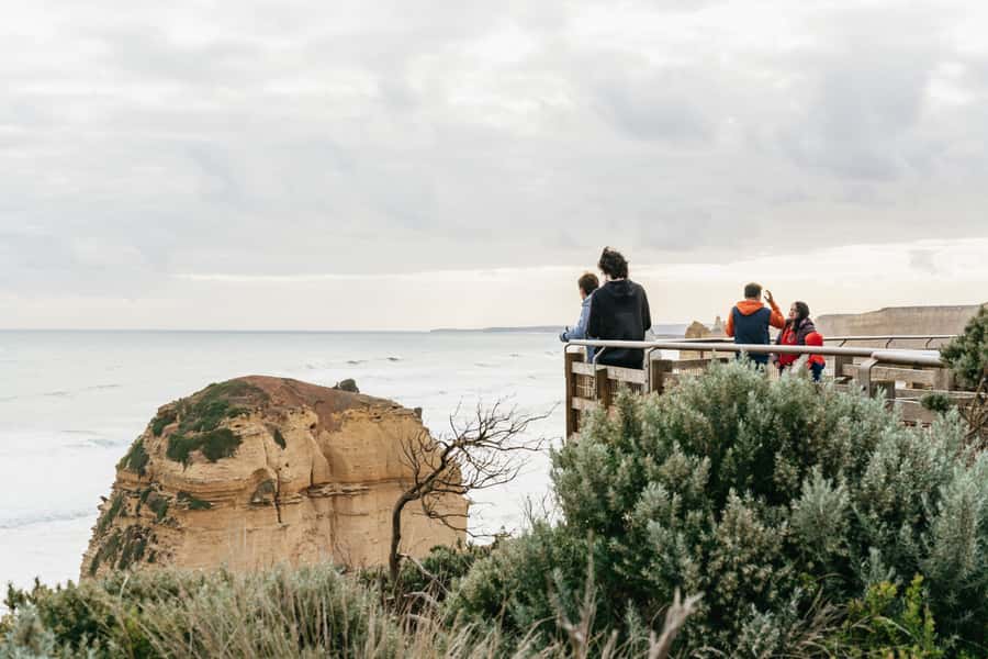 From Melbourne: Small-Group Great Ocean Road Day Trip - From Rendezvous Hotel Melbourne to a dark-blue Mercedes Sprinter